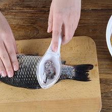 Fish scraper tool with ergonomic handle for easy use.