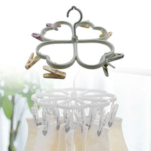 Clothes spin rack with heart shape and clips for drying