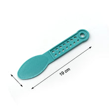 Plastic foot scrubber with textured surface.