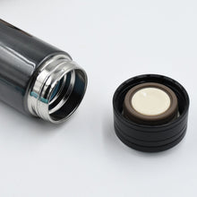 Modern stainless steel travel thermos.