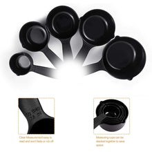 Black plastic measuring cups and spoons arranged with a butterfly-shaped holder for convenience