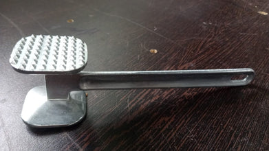 Heavy-duty meat hammer, perfect for tenderizing beef.